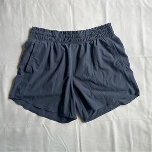 Under Armour Women's Athletic Shorts in Dark Blue Gray. Size L.